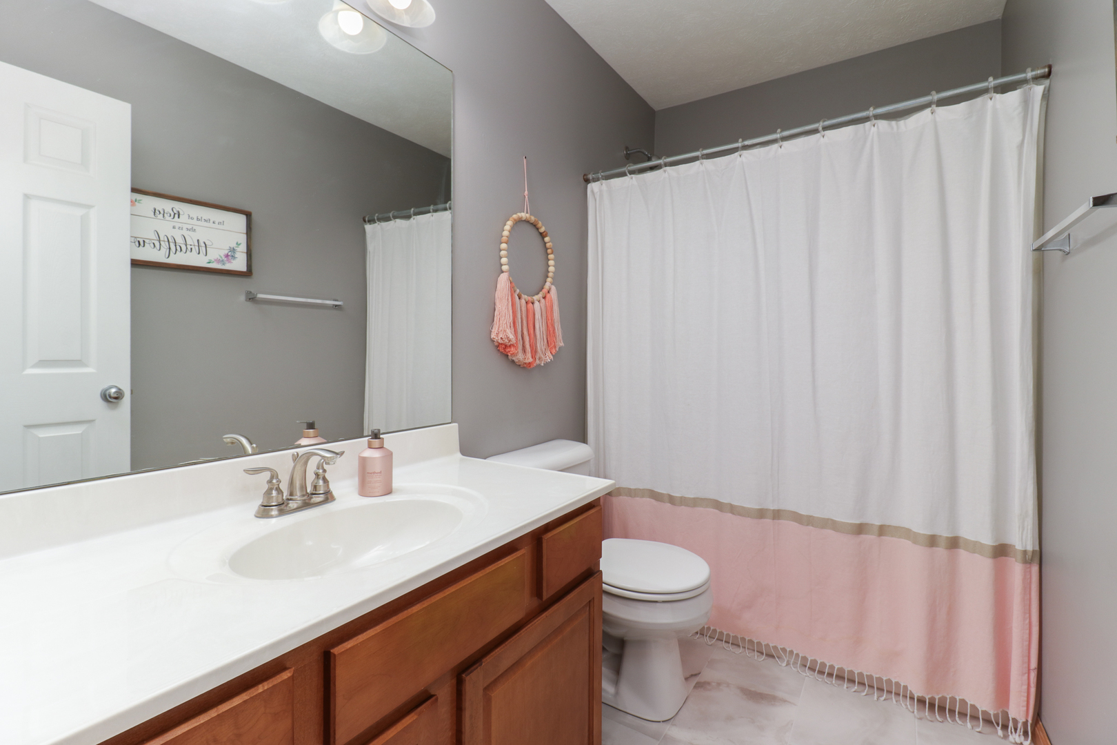 1820 Chuck Murray Drive Normal, IL 61761 - Photo 27 of 46 a bathroom with a sink a toilet and shower curtain