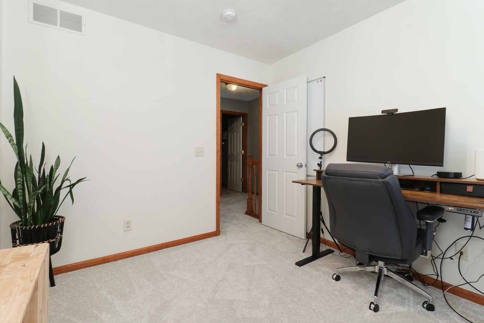 1820 Chuck Murray Drive Normal, IL 61761 - Photo 29 of 46 a view of a workspace with furniture and a potted plant