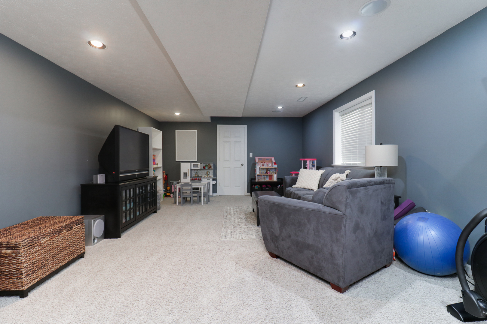 1820 Chuck Murray Drive Normal, IL 61761 - Photo 32 of 46 a living room with furniture and a flat screen tv