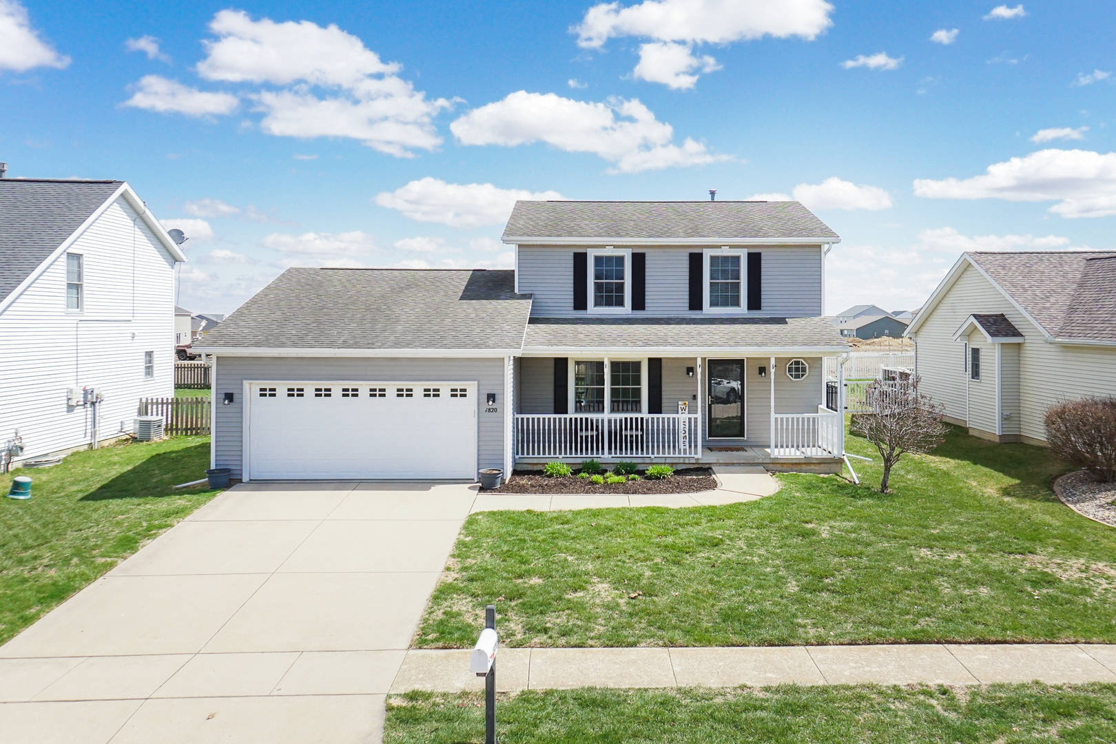 1820 Chuck Murray Drive Normal, IL 61761 - Photo 45 of 46 a front view of a house with a yard table and chairs
