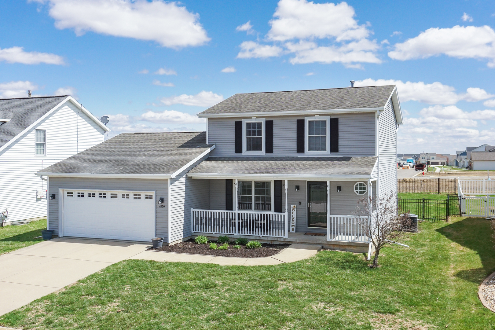 1820 Chuck Murray Drive Normal, IL 61761 - Photo 46 of 46 a front view of a house with a yard and garage