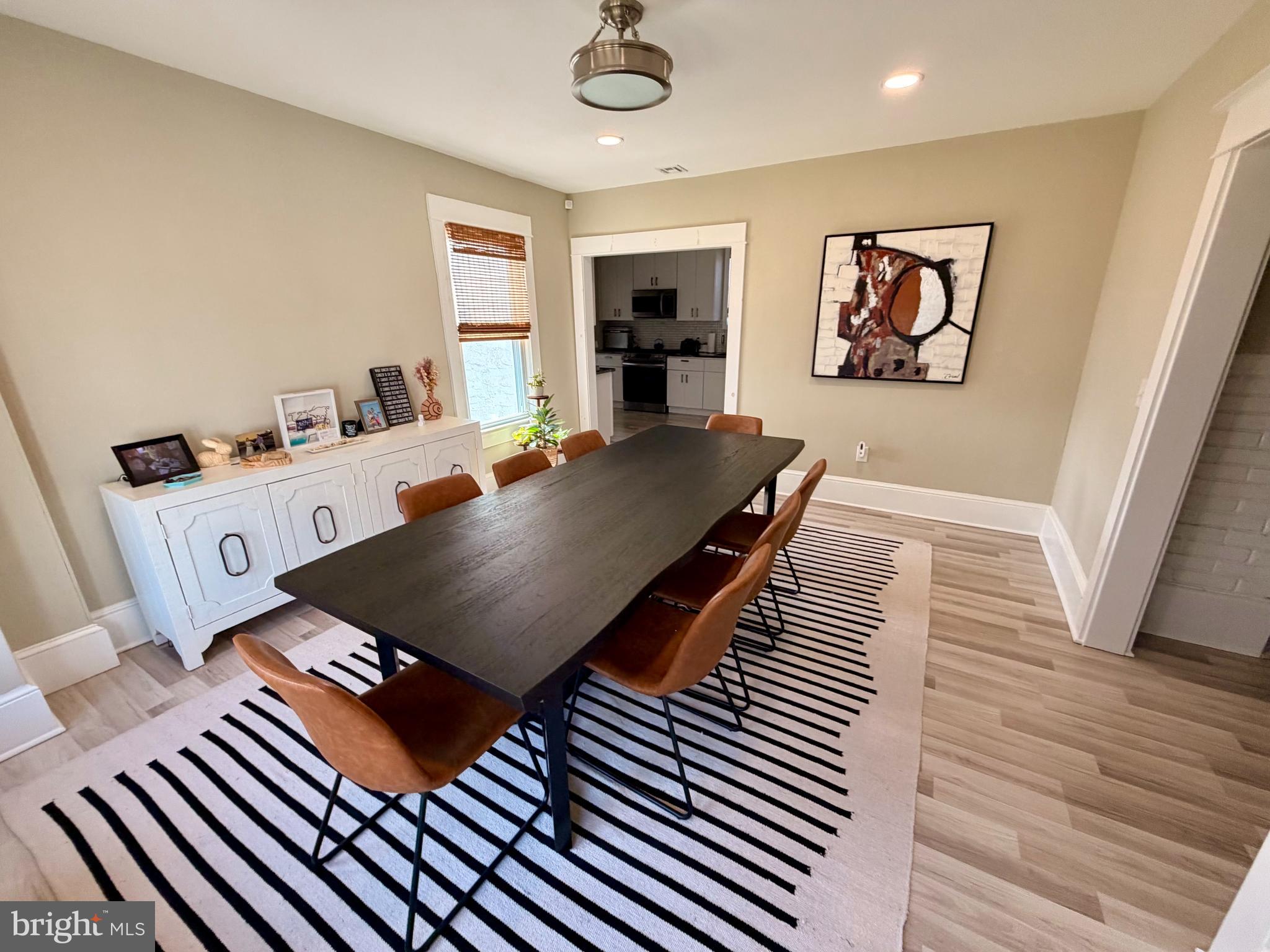 4053 Nottingham Way Hamilton, NJ 08690 - Photo 24 of 29 a living room with furniture floor to ceiling window and wooden floor
