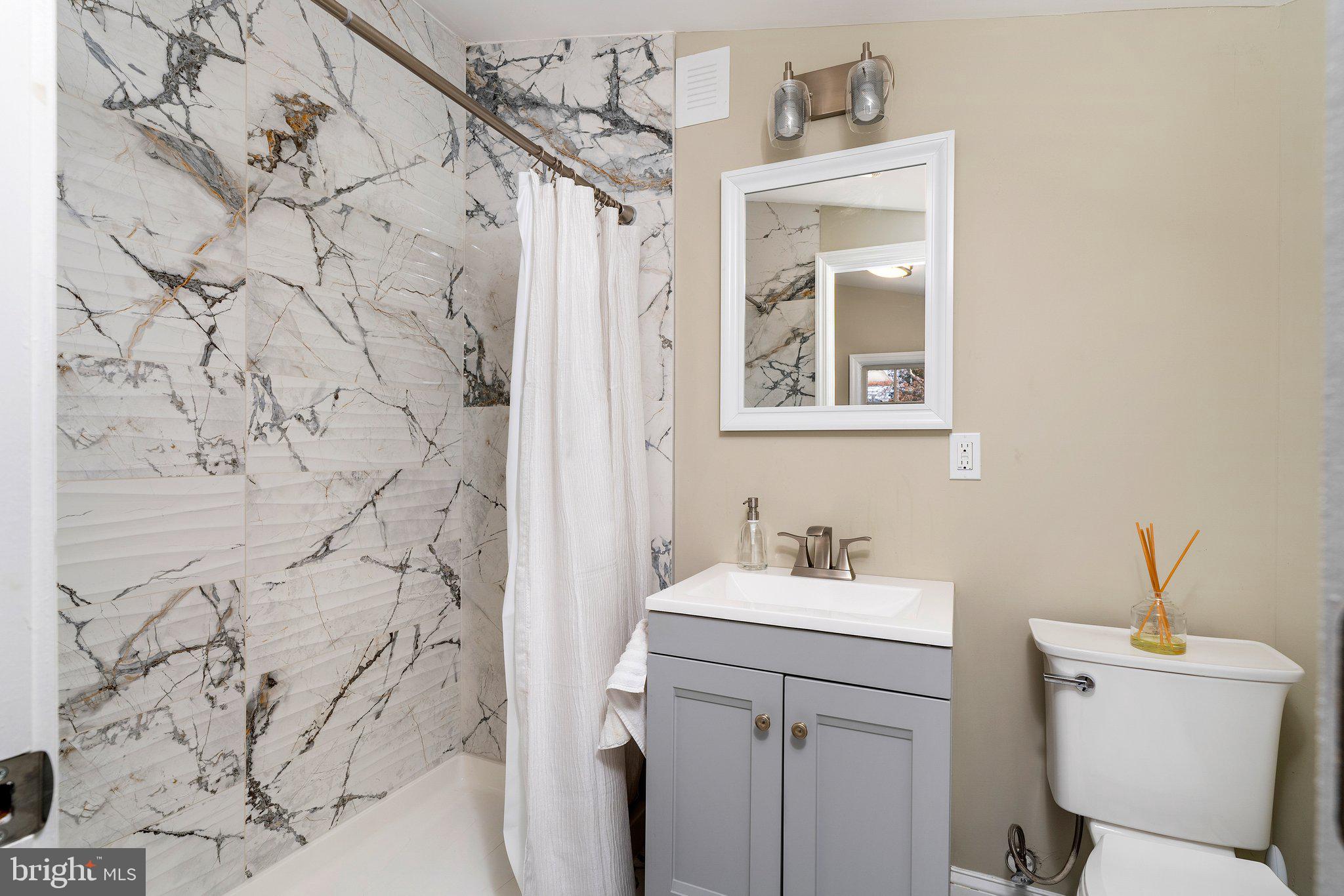 4053 Nottingham Way Hamilton, NJ 08690 - Photo 25 of 29 a bathroom with a sink and a toilet