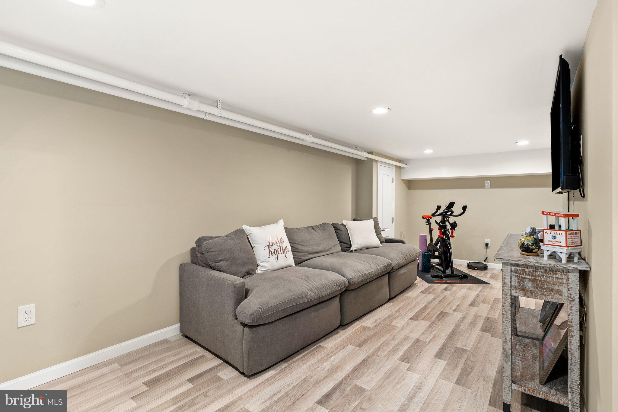 4053 Nottingham Way Hamilton, NJ 08690 - Photo 26 of 29 a living room with furniture and a flat screen tv