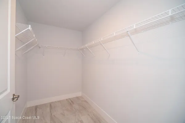 a view of a room with racks on the wall