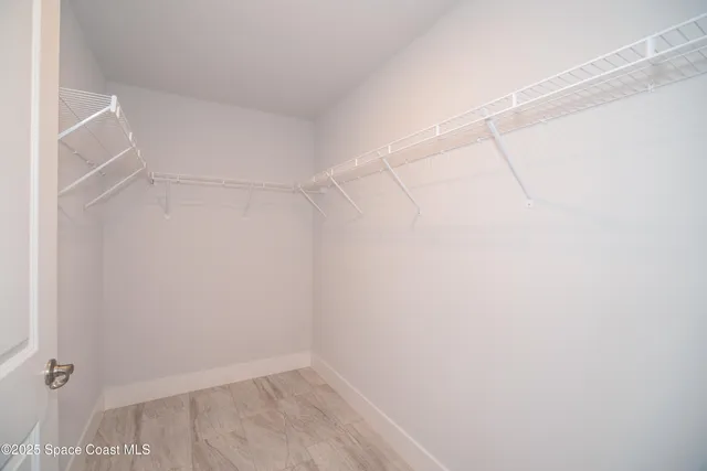 a view of a room with racks on the wall