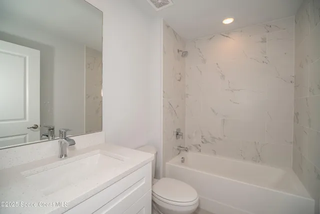 a bathroom with a sink a toilet and a bathtub