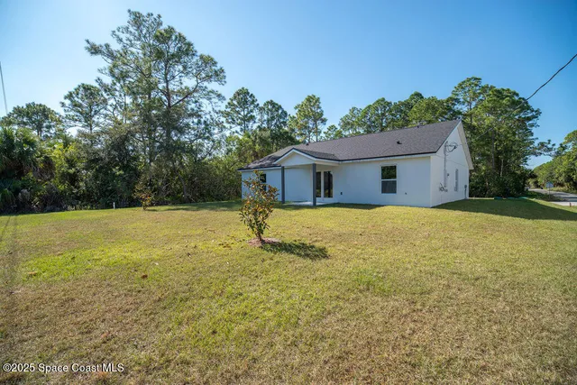 a house with yard in front of it
