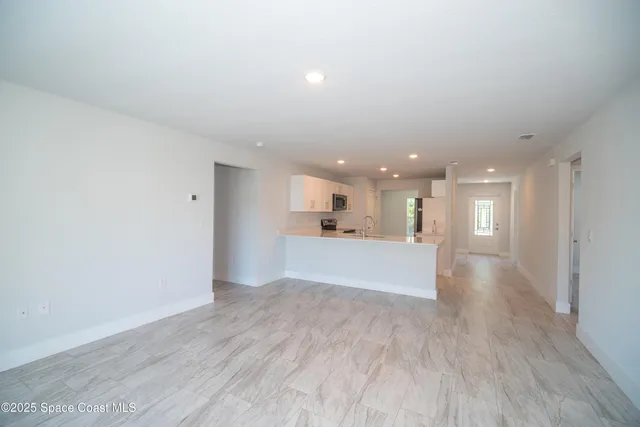 a view of kitchen and kitchen with electric equipment