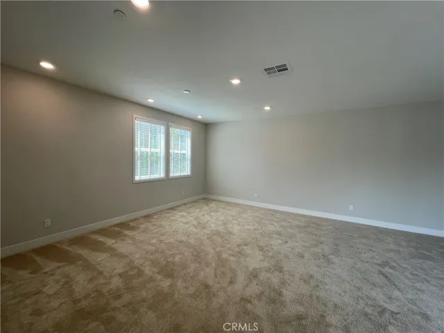 a kitchen with a refrigerator and a sink