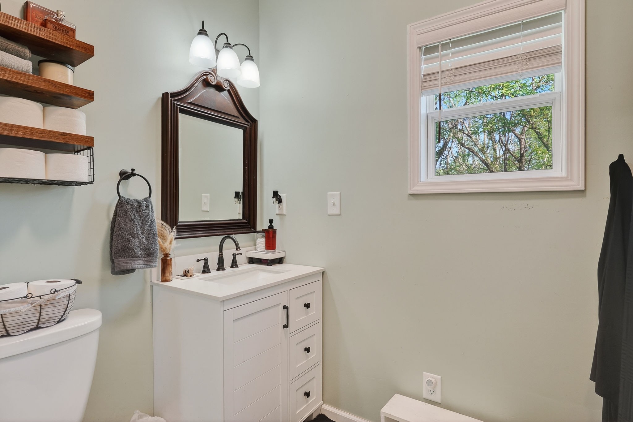 3820 Jefferson Road Smithville, TN 37166 - Photo 14 of 31 a bathroom with a toilet sink and mirror