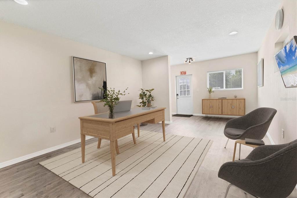 3045 Logue Road Myakka City, FL 34251 - Photo 13 of 32 a living room with furniture and a wooden floor