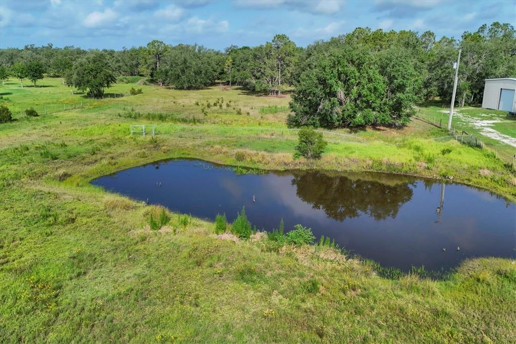 3045 Logue Road Myakka City, FL 34251 - Photo 29 of 32 a view of a lake with a yard