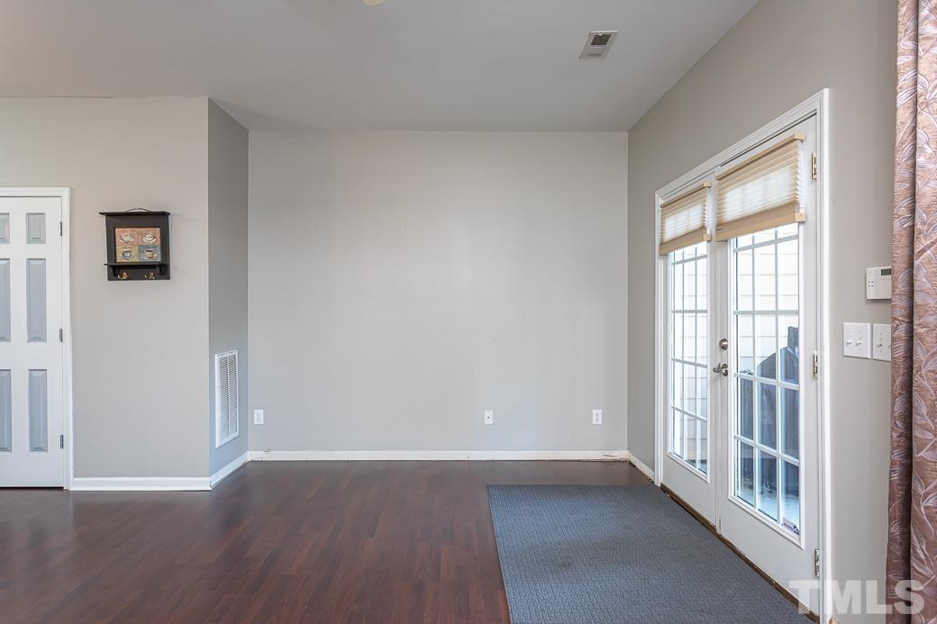4439 Moss Garden Path Raleigh, NC 27616 - Photo 18 of 30 wooden floor in an empty room with a window