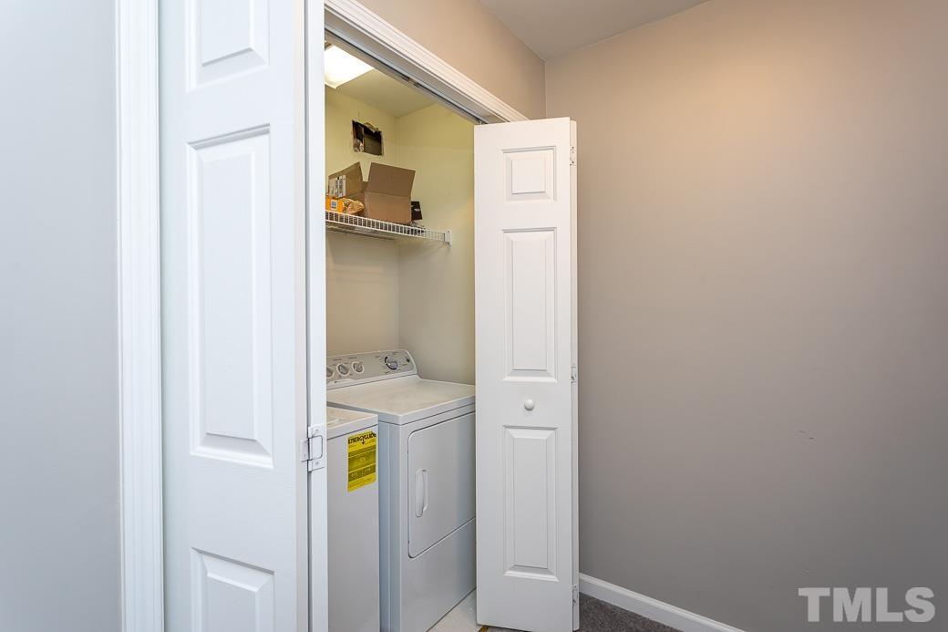 4439 Moss Garden Path Raleigh, NC 27616 - Photo 20 of 30 a bathroom with a sink and toilet