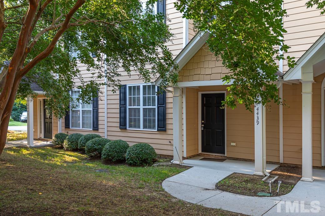 4439 Moss Garden Path Raleigh, NC 27616 - Photo 3 of 30 a front view of a house with garden