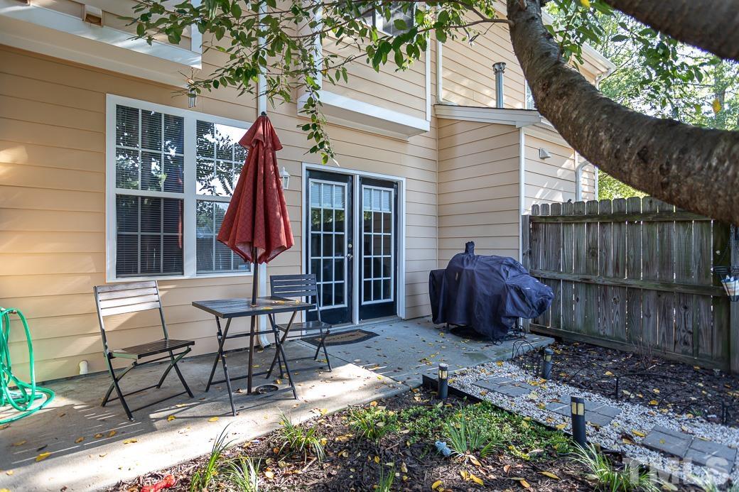 4439 Moss Garden Path Raleigh, NC 27616 - Photo 29 of 30 a view of a chair and table in backyard of the house