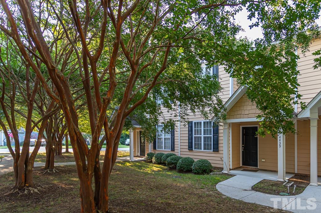 4439 Moss Garden Path Raleigh, NC 27616 - Photo 4 of 30 a front view of a house with garden
