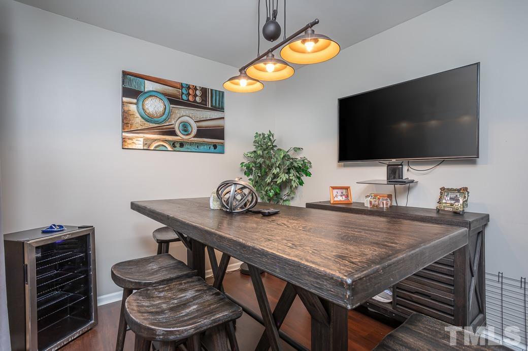 4439 Moss Garden Path Raleigh, NC 27616 - Photo 6 of 30 a table and chairs in a room