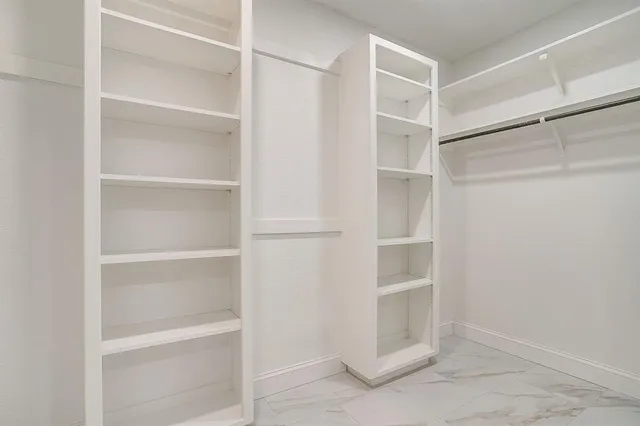 a view of an empty walk in closet