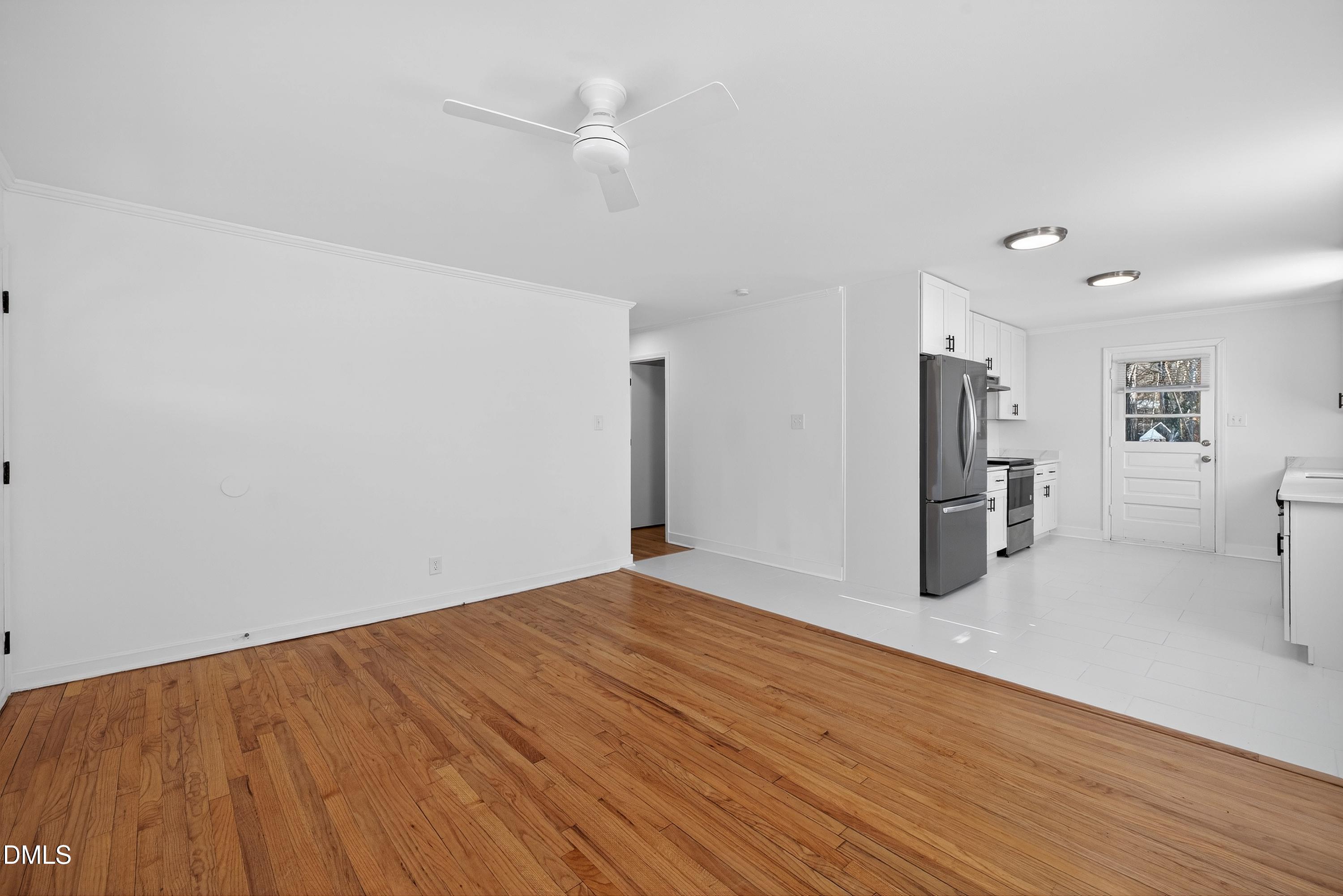 302 Normandy Street Durham, NC 27707 - Photo 6 of 29 a view of empty room with wooden floor