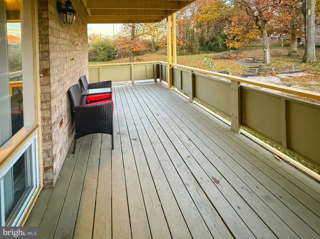 a view of a balcony with wooden floor