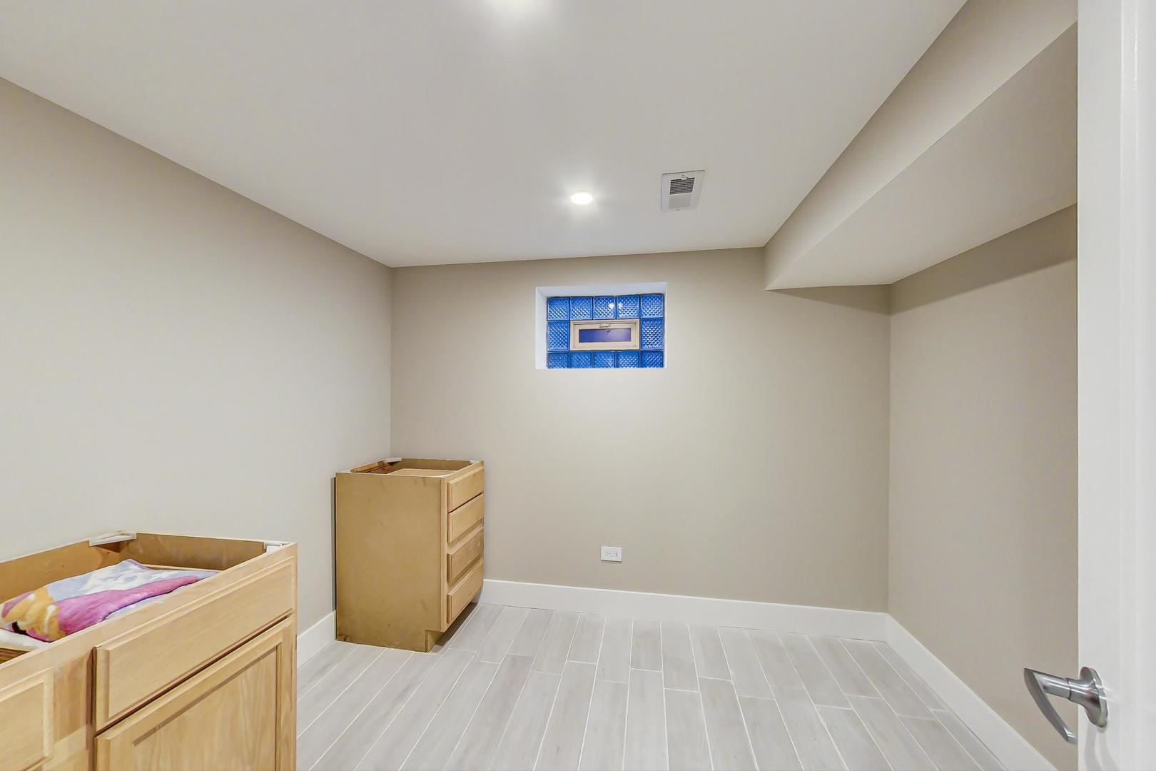 443 Raupp Boulevard Buffalo Grove, IL 60089 - Photo 14 of 21 a view of room with window and wooden floor