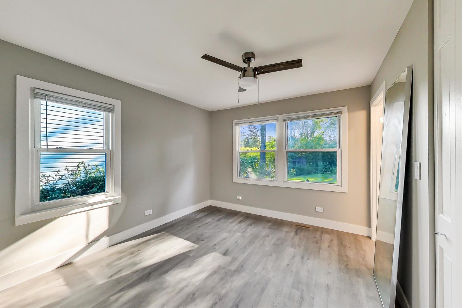 443 Raupp Boulevard Buffalo Grove, IL 60089 - Photo 6 of 21 a view of room with window and a ceiling fan