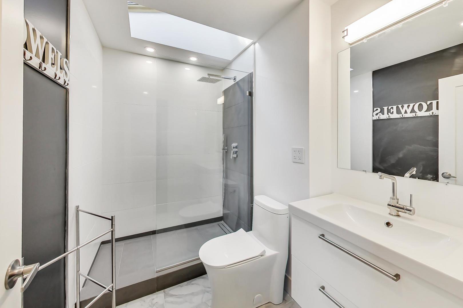 443 Raupp Boulevard Buffalo Grove, IL 60089 - Photo 8 of 21 a bathroom with a sink toilet and shower