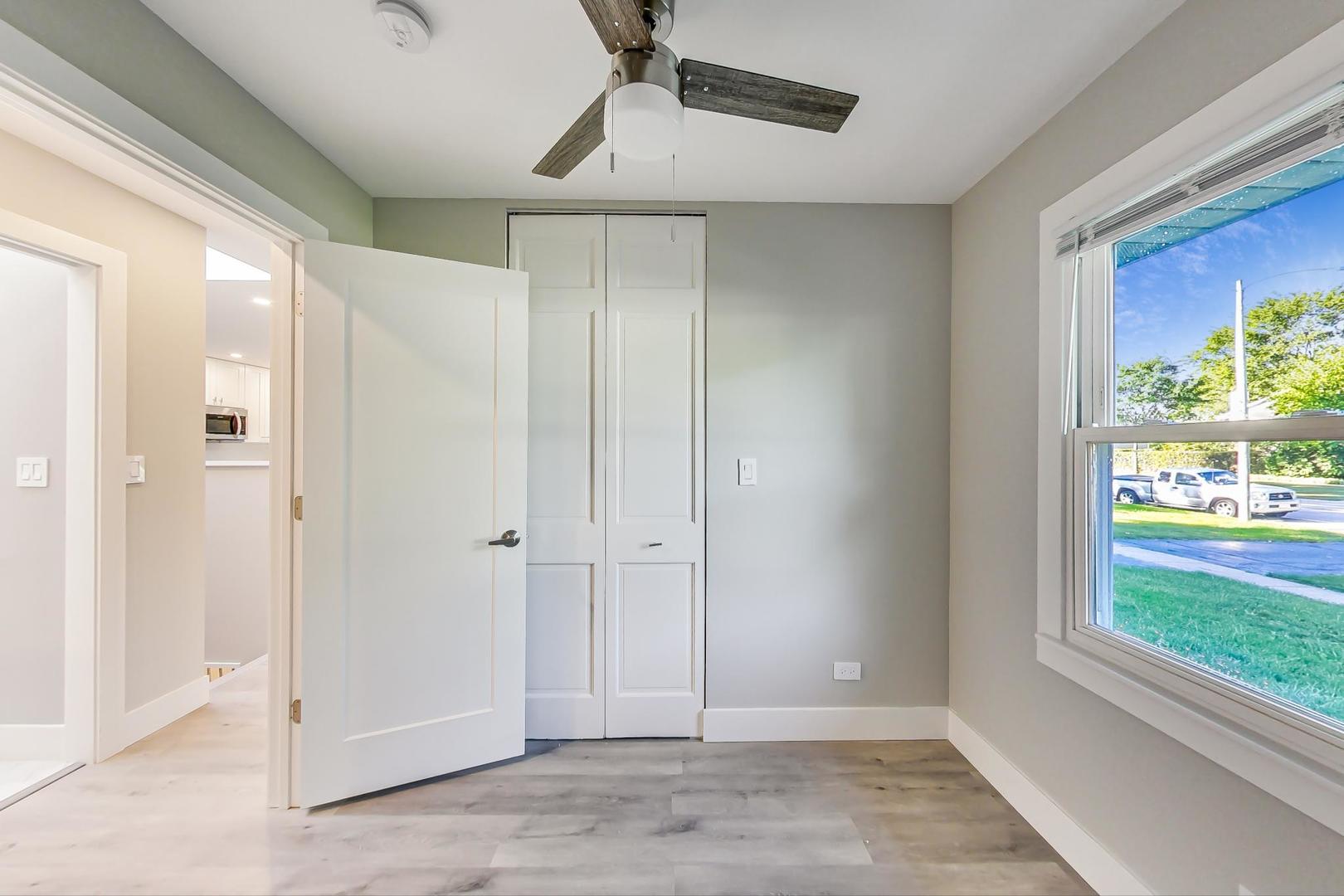 443 Raupp Boulevard Buffalo Grove, IL 60089 - Photo 10 of 21 a view of an entryway with wooden floor and windows