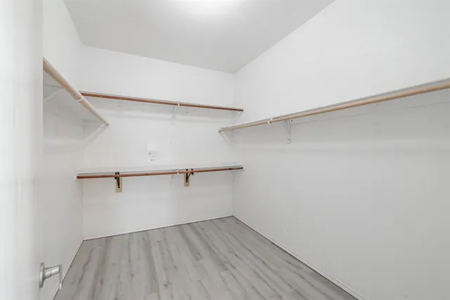 a view of an empty walk in closet