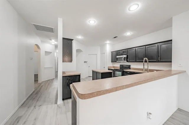 a large kitchen with a lot of counter space