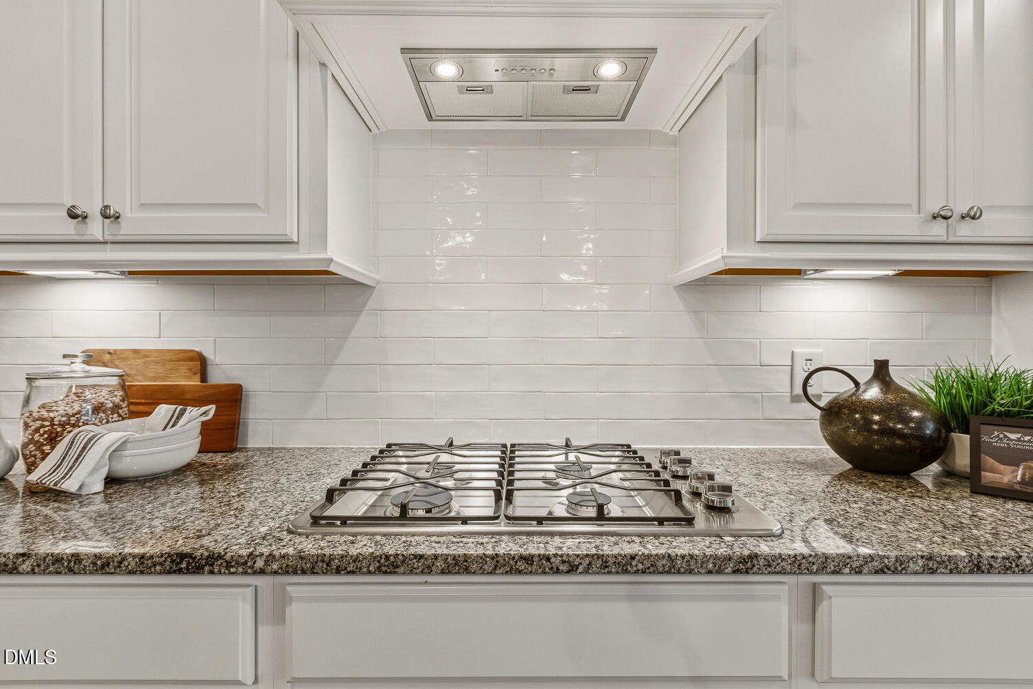 1345 Catlette Street Apex, NC 27523 - Photo 11 of 74 a kitchen with white cabinets and a granite counter