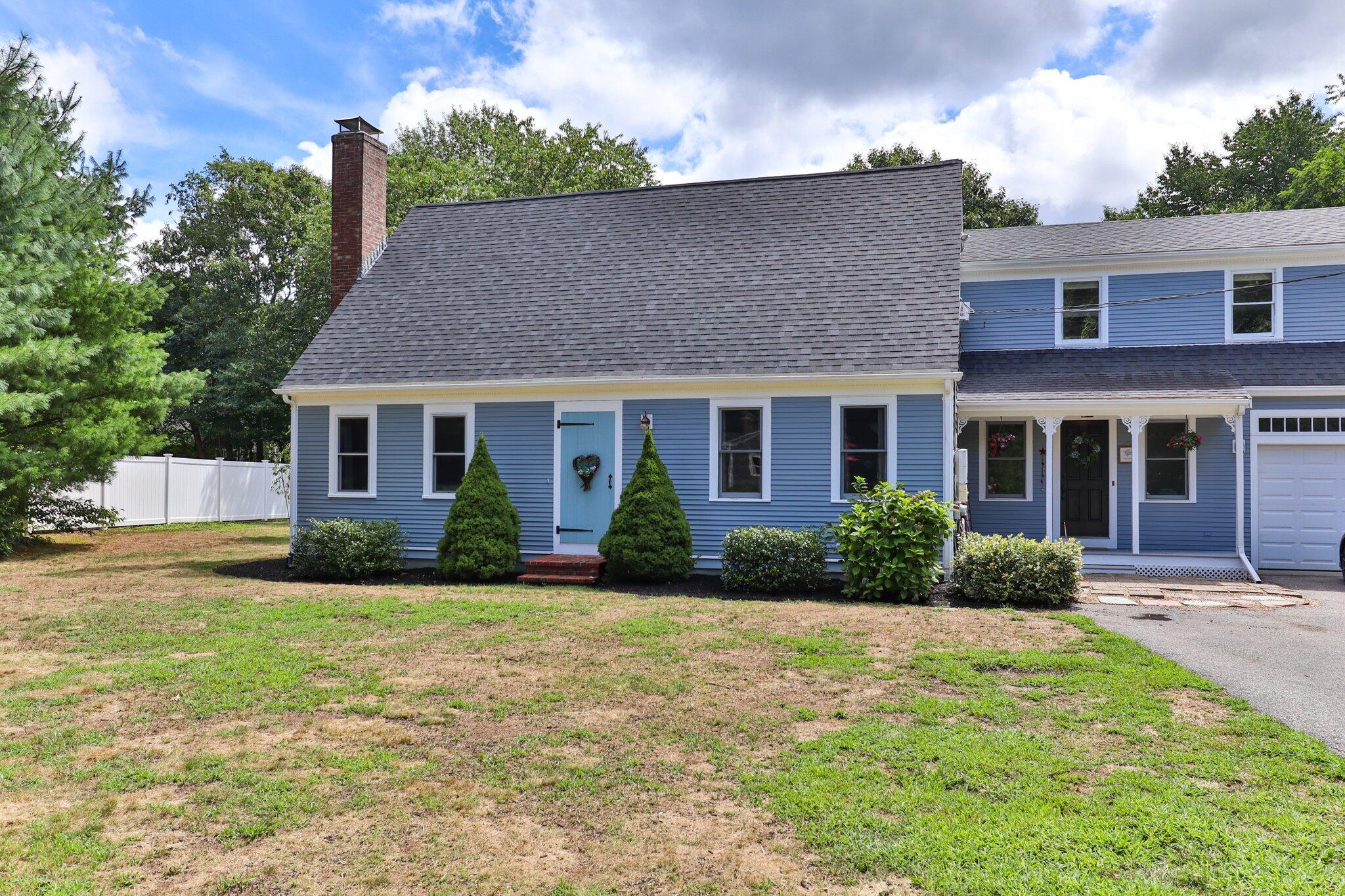 56 Mill Road East Sandwich, MA 02537 - Photo 1 of 63 a front view of a house with a yard