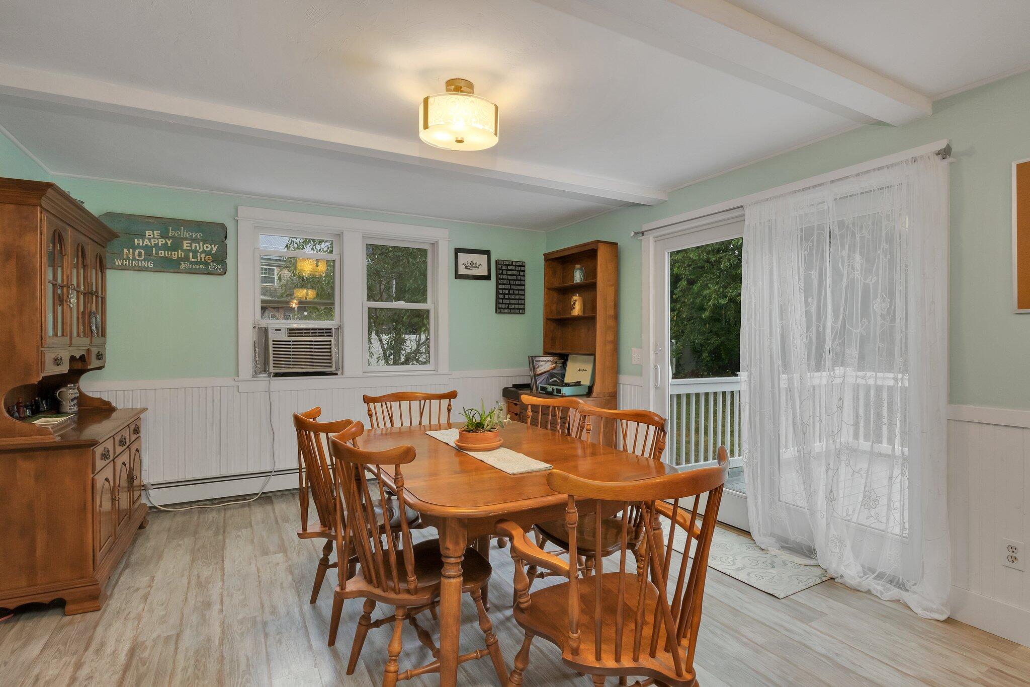 56 Mill Road East Sandwich, MA 02537 - Photo 12 of 63 a view of a dining room with furniture and wooden floor