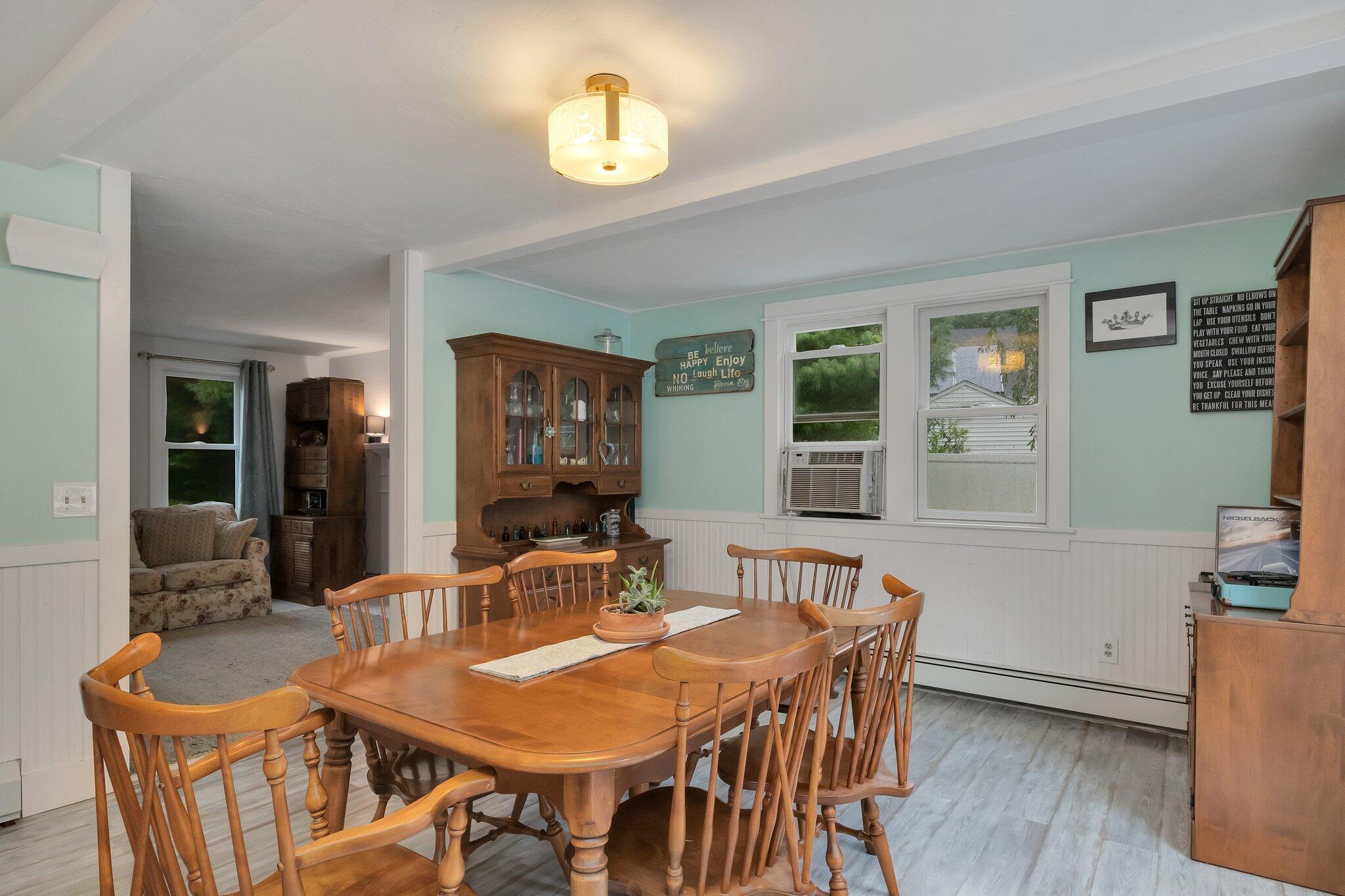 56 Mill Road East Sandwich, MA 02537 - Photo 13 of 63 a view of a dining room with furniture and wooden floor