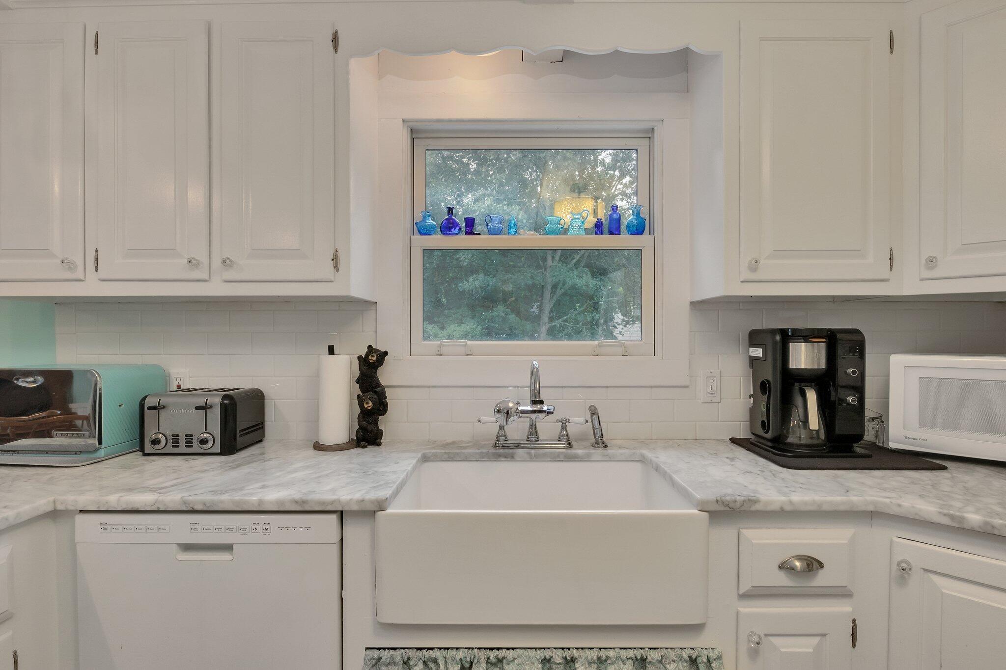 56 Mill Road East Sandwich, MA 02537 - Photo 17 of 63 a kitchen with granite countertop a sink and a stove top oven