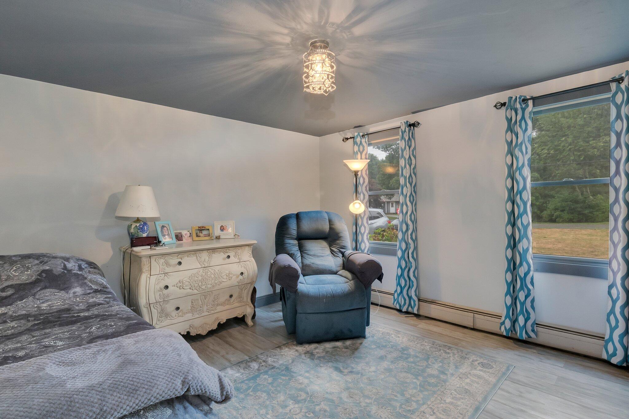 56 Mill Road East Sandwich, MA 02537 - Photo 22 of 63 a room with a bed and a large window