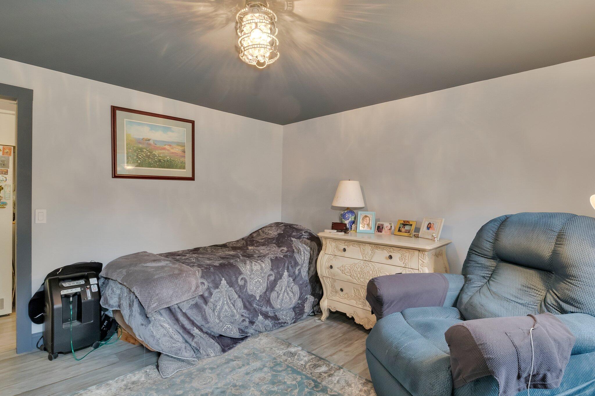 56 Mill Road East Sandwich, MA 02537 - Photo 23 of 63 a bedroom with a bed and a chair