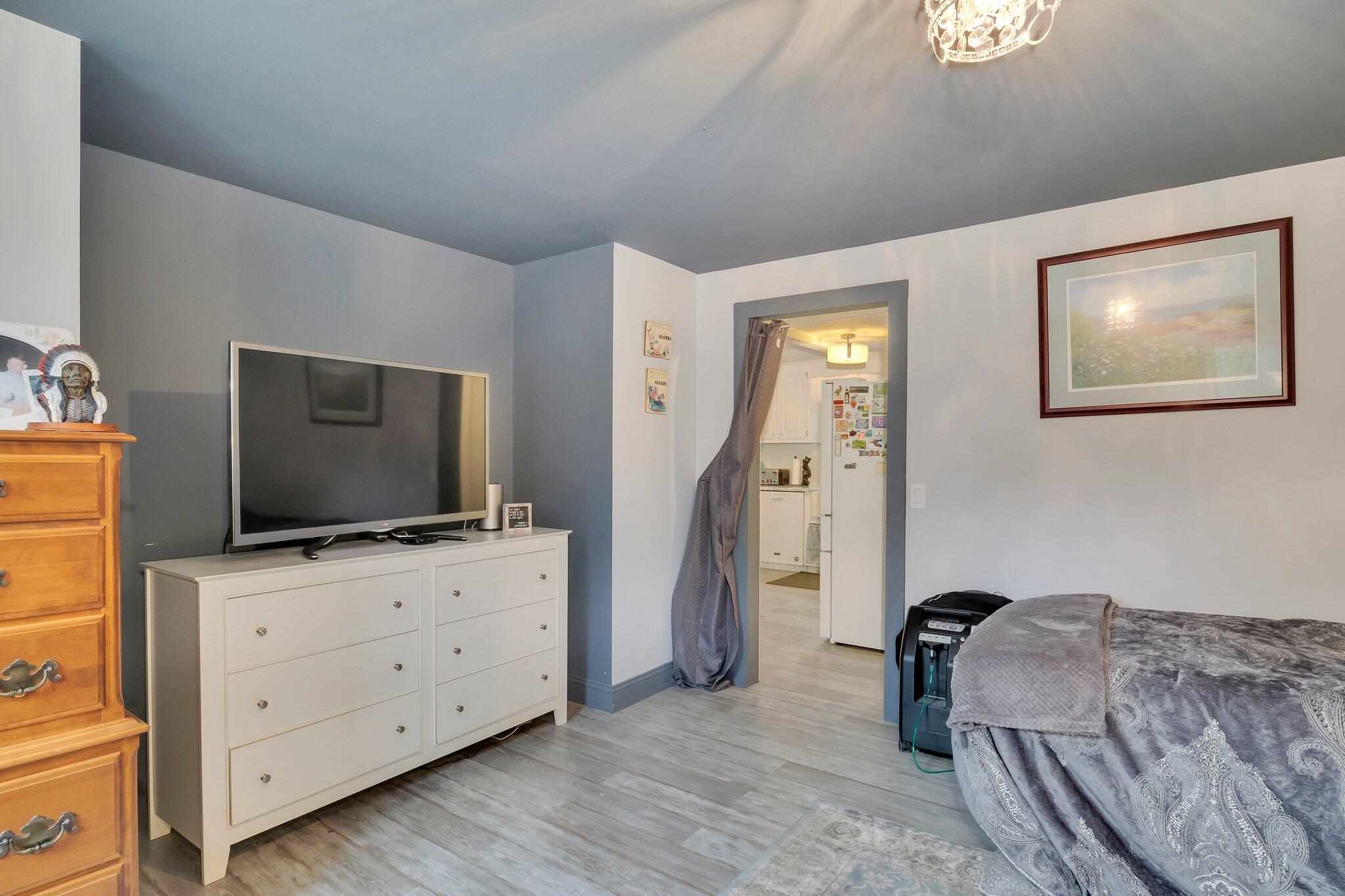 56 Mill Road East Sandwich, MA 02537 - Photo 24 of 63 a bedroom with furniture and a flat screen tv
