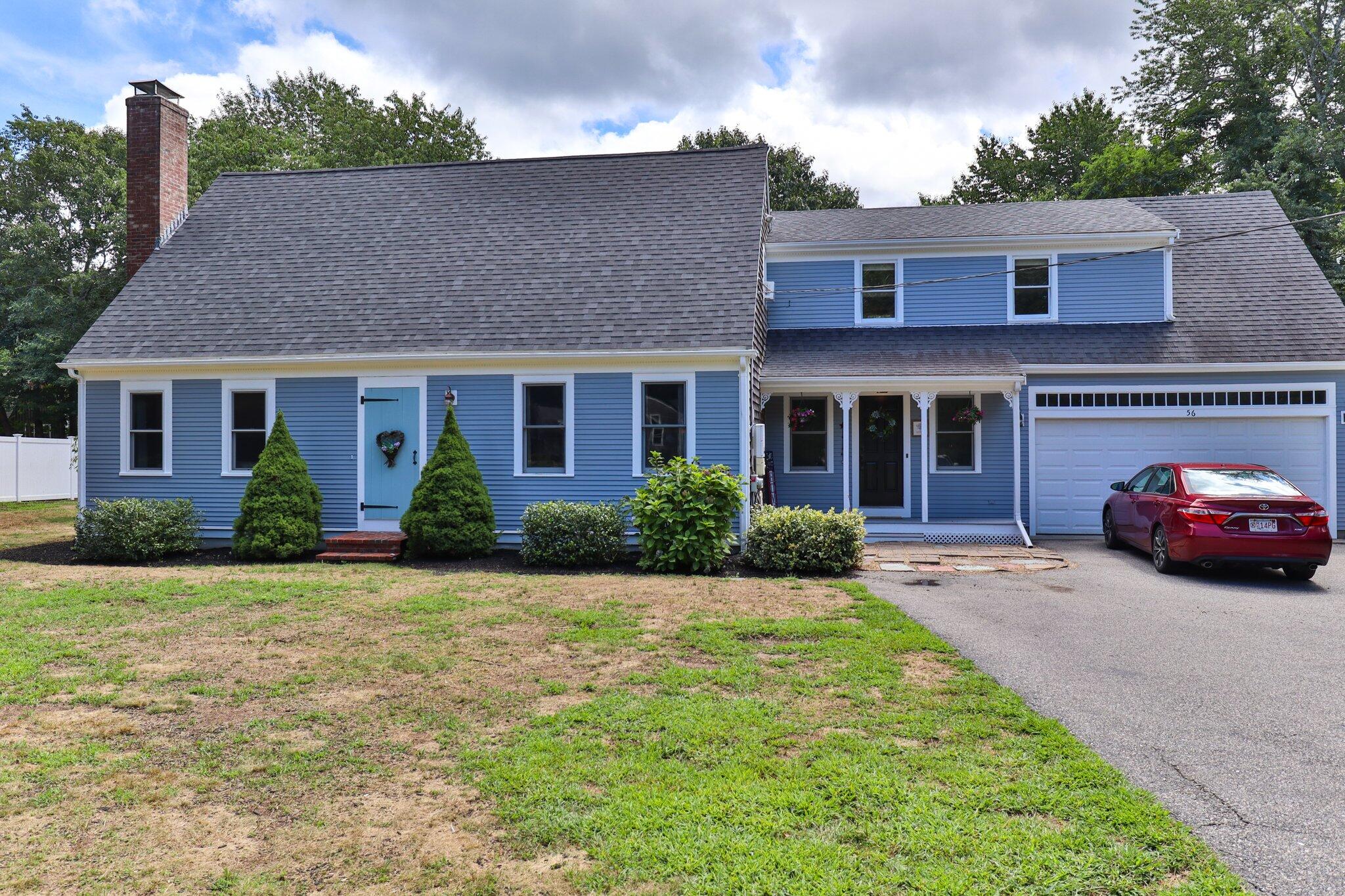 56 Mill Road East Sandwich, MA 02537 - Photo 3 of 63 a front view of a house with garden
