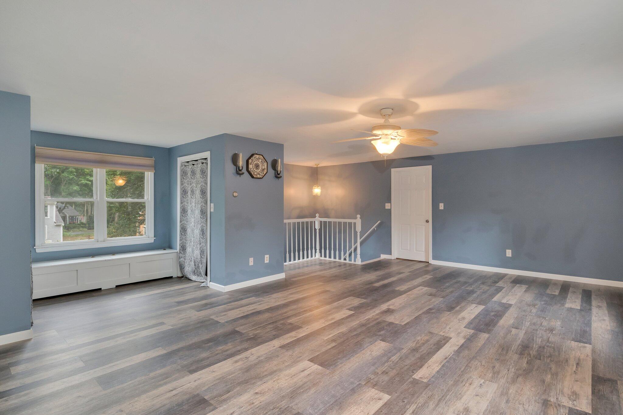 56 Mill Road East Sandwich, MA 02537 - Photo 32 of 63 a view of an empty room with window and wooden floor