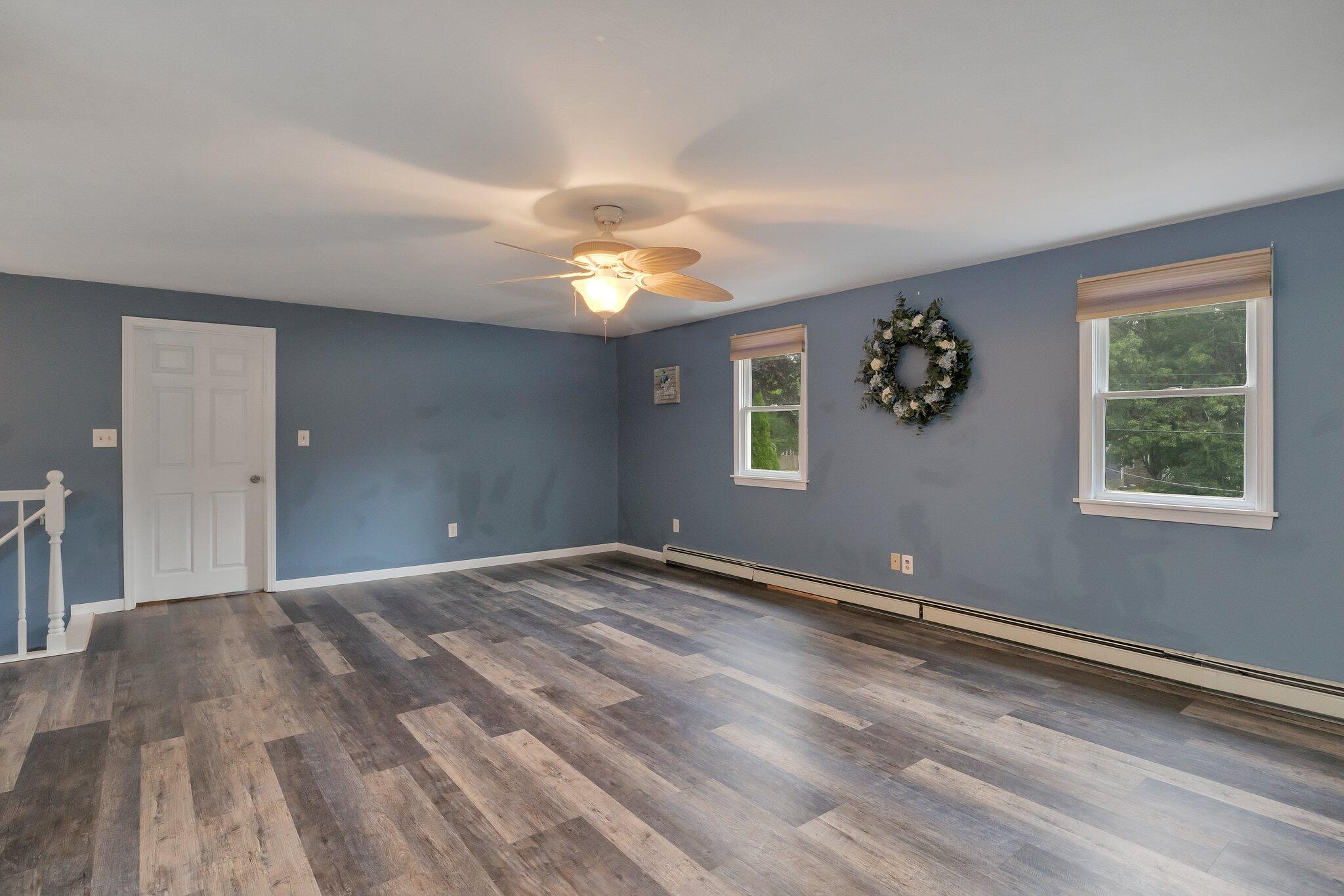 56 Mill Road East Sandwich, MA 02537 - Photo 33 of 63 a view of an empty room with window and chandelier fan