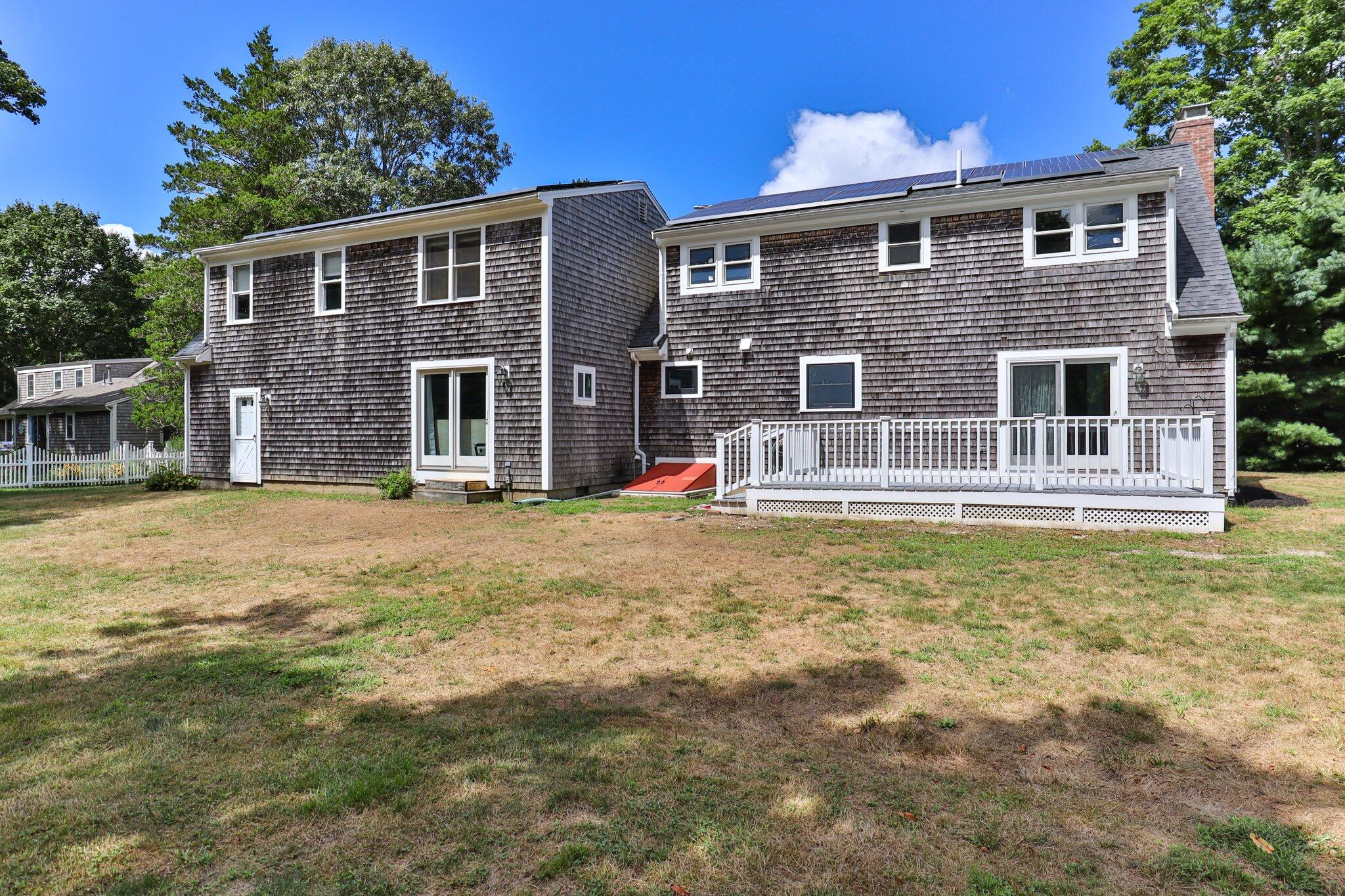56 Mill Road East Sandwich, MA 02537 - Photo 45 of 63 a front view of a house with large windows