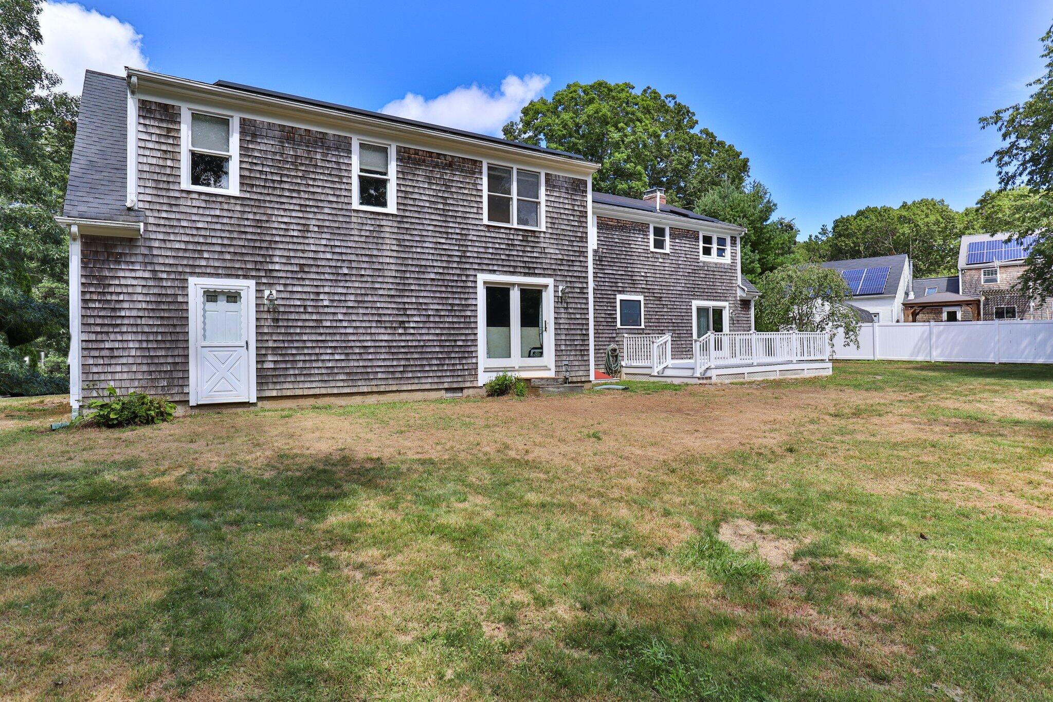 56 Mill Road East Sandwich, MA 02537 - Photo 47 of 63 a front view of a house with a garden