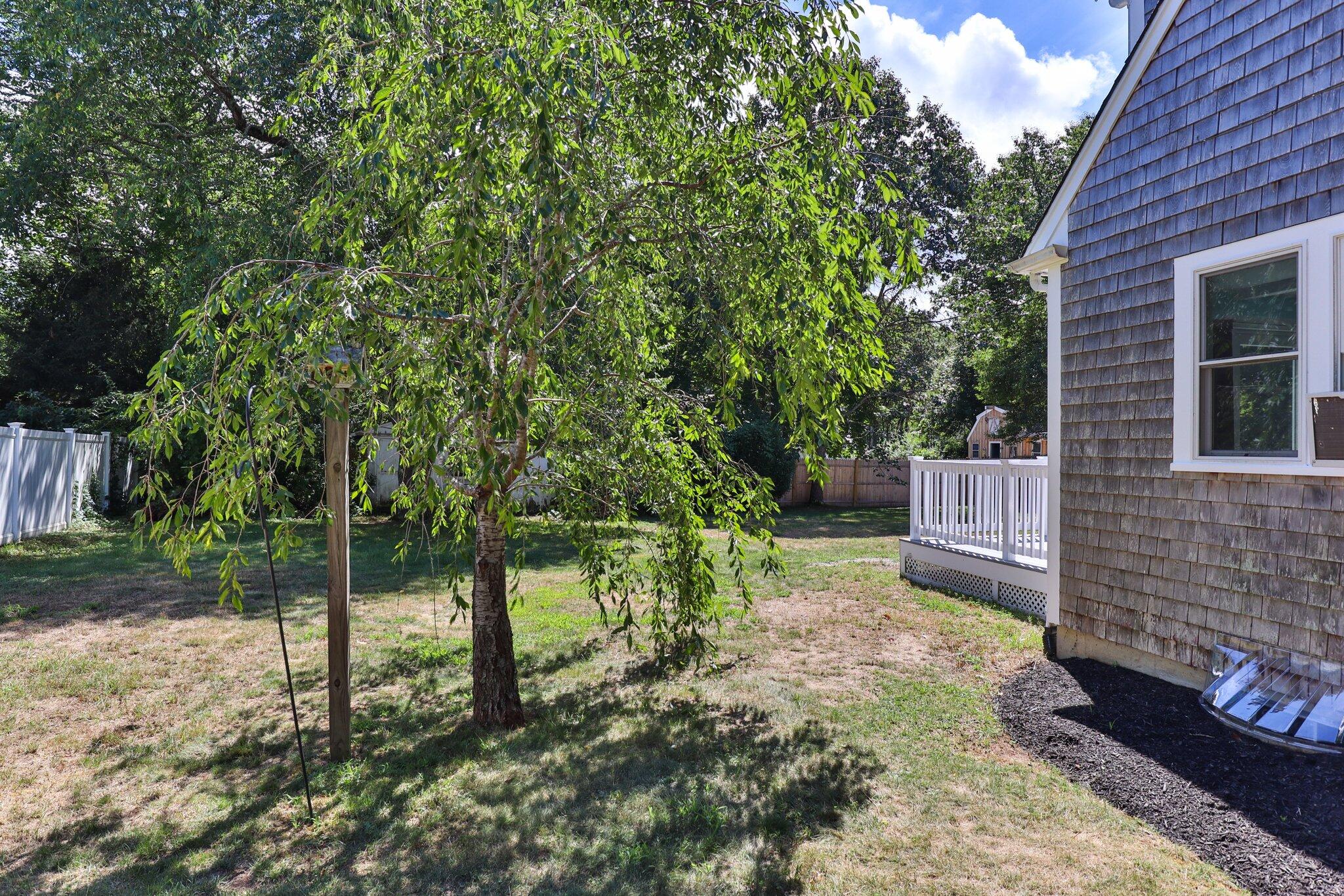 56 Mill Road East Sandwich, MA 02537 - Photo 53 of 63 a view of a backyard with wooden fence