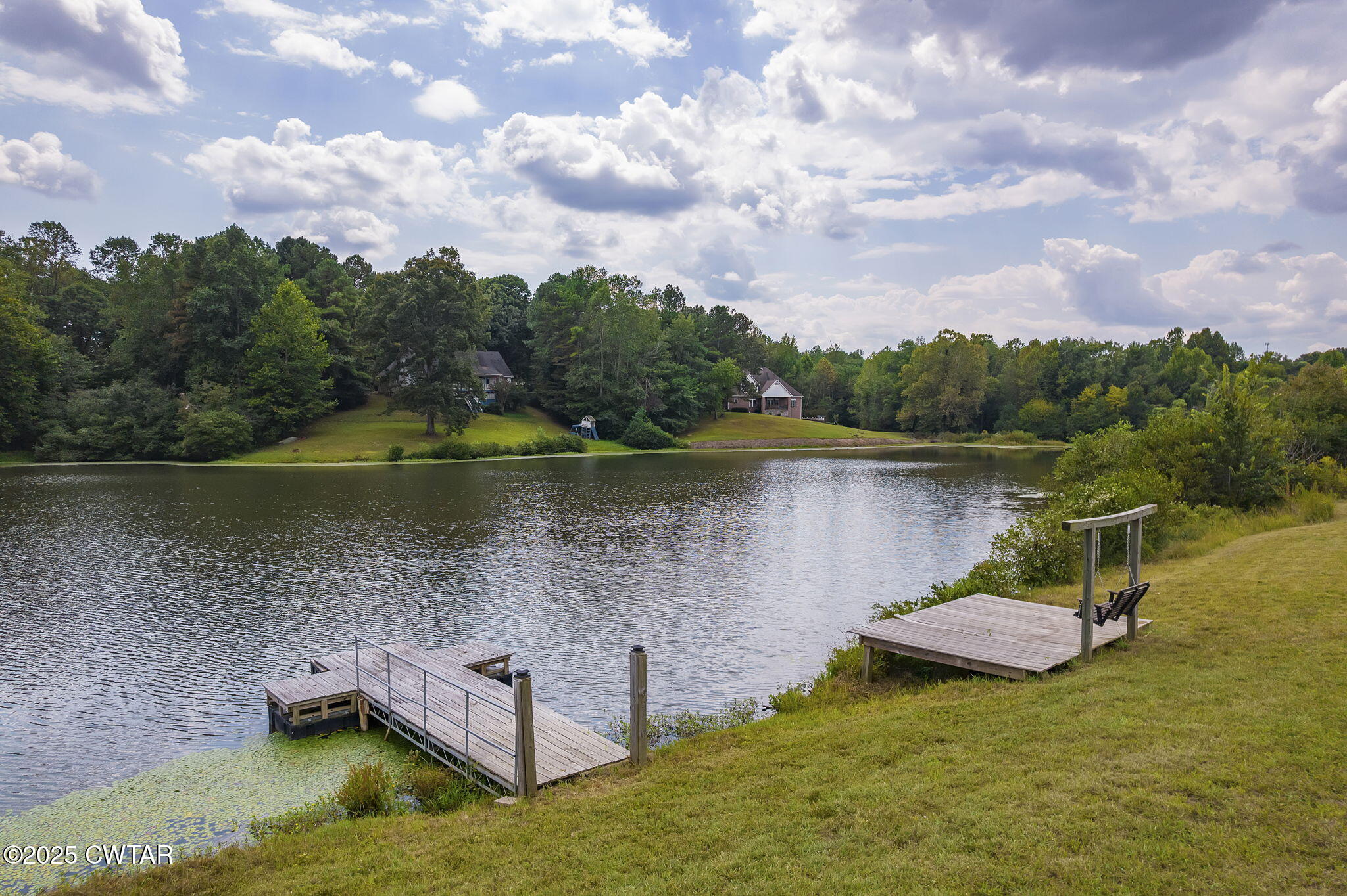 413 Law Lane Lexington, TN 38351 - Photo 16 of 25 a view of a lake in between two chairs