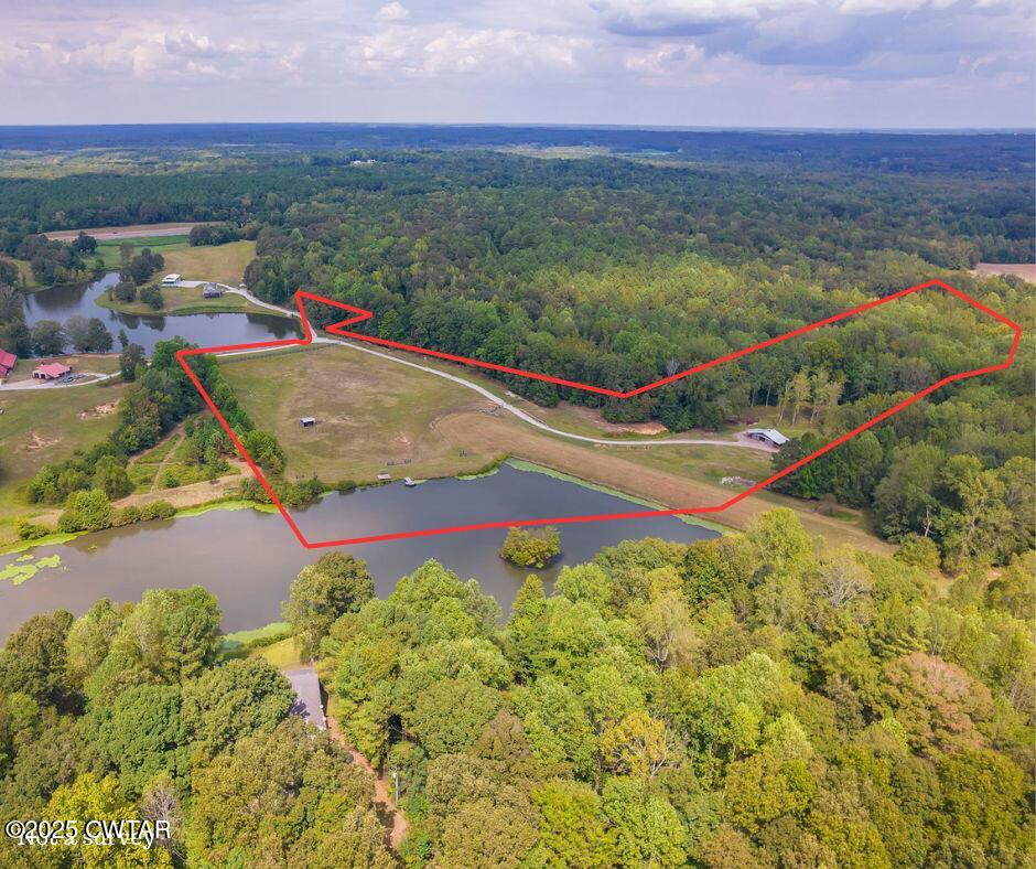 413 Law Lane Lexington, TN 38351 - Photo 2 of 25 an aerial view of residential houses with outdoor space