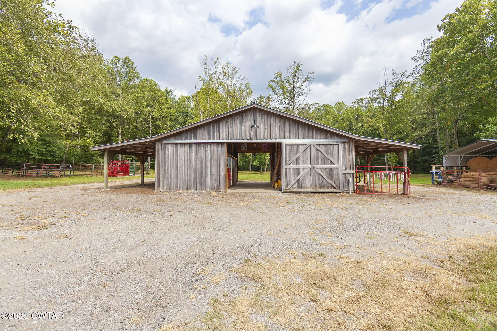 413 Law Lane Lexington, TN 38351 - Photo 4 of 25 a view of large house with wooden fence and large trees