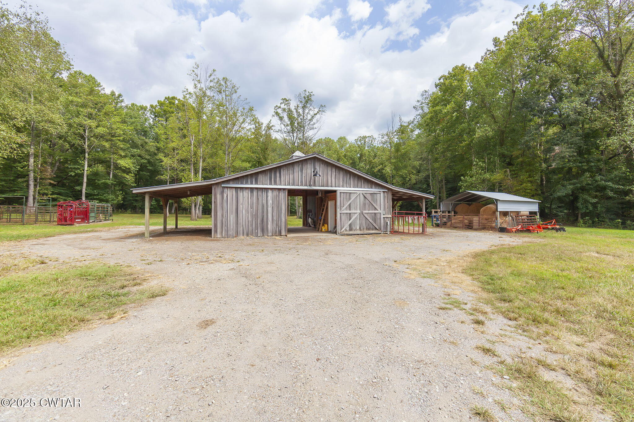 413 Law Lane Lexington, TN 38351 - Photo 5 of 25 a backyard of a house with table and chairs
